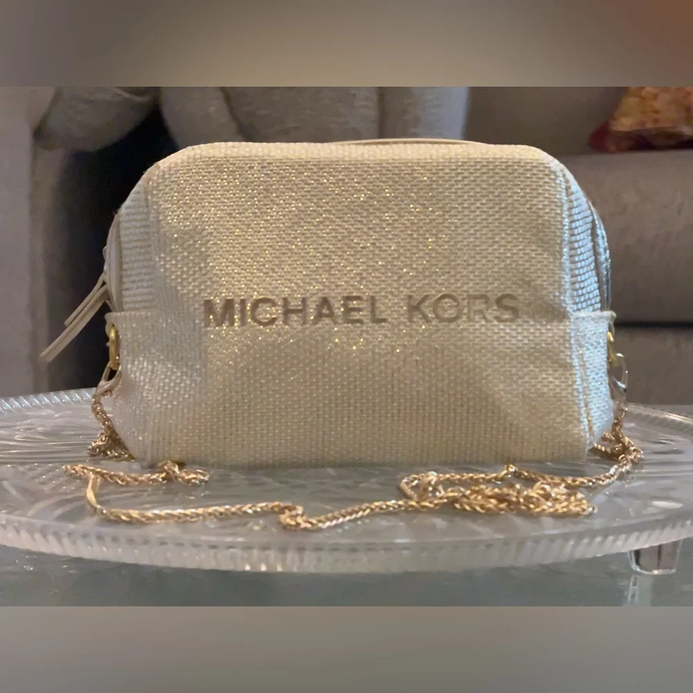Michael Kors Shimmering Cream Gold Pouch with golden sling